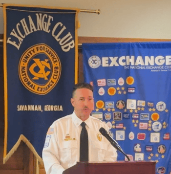 CCFD Captain Grant Flummerfelt announces award designations at the Exchange Club of Savannah ceremony