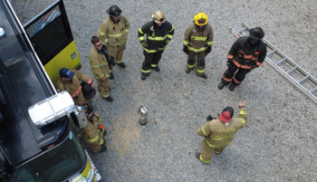 Overhead view of seven firefighters in turnout gear
