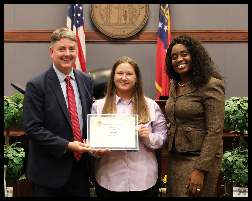 Chatham County Juvenile Court Presiding Judge, Thomas Cole; Anchor Court graduate, Charli Bennett; and Anchor Court Coordinator, Latrell Gulotta