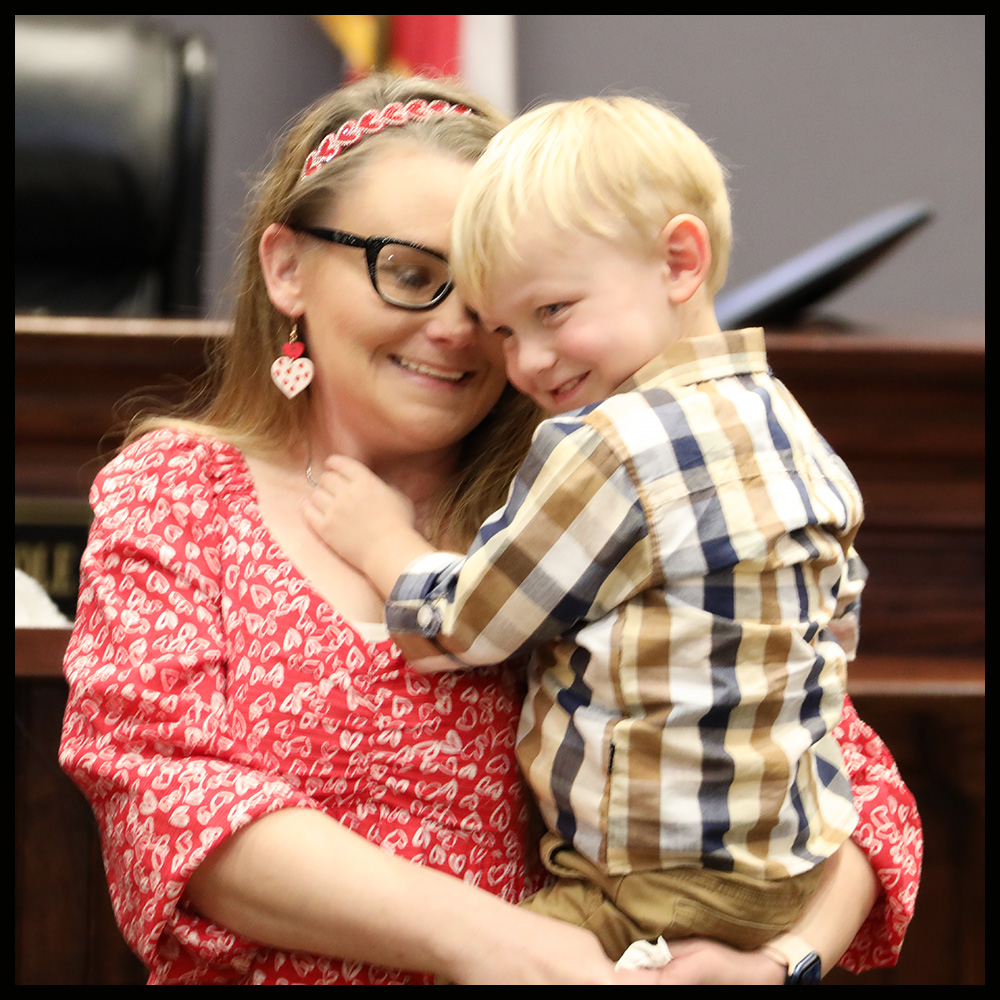 Anchor Court graduate Heather England and her son are all smiles after graduation