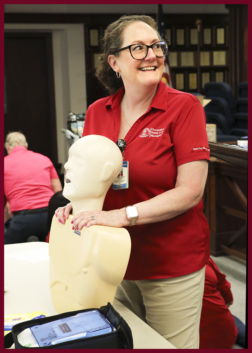 Team Chatham member smiles while instructing a CPR class