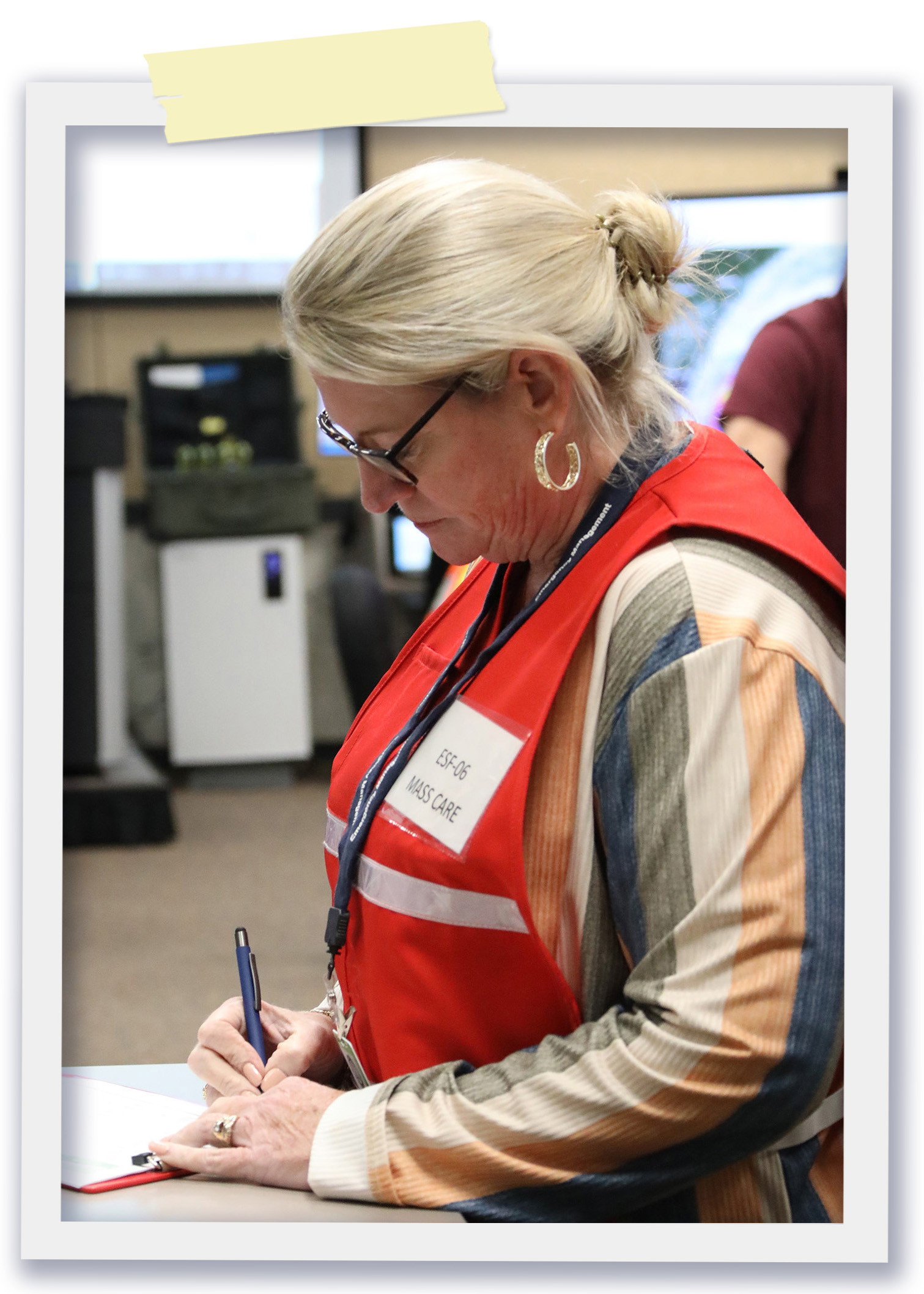 County Leader studies emergency response materials during activation